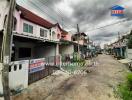 Street view of suburban pink houses with overcast sky