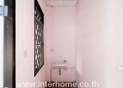 Narrow corridor with sink and window