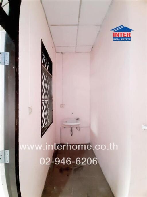 Narrow corridor with sink and window