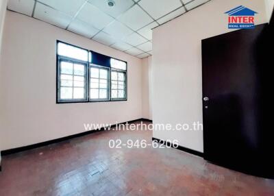 Empty Office Room with Large Windows and Tiled Floor