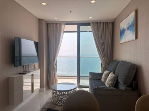 Cozy living room with ocean view and modern furniture