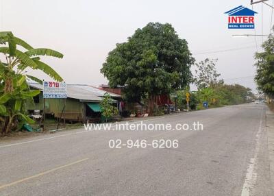 Street view of residential area with visible contact information