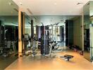 Spacious home gym with modern equipment and large mirrors