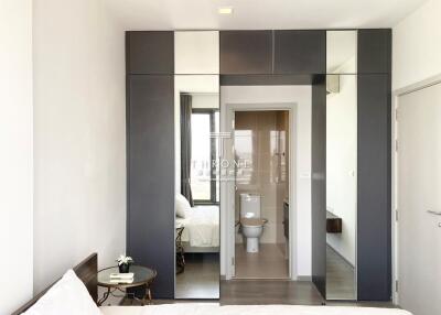 Modern bedroom with sleek design and attached bathroom