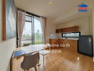 Bright and functional kitchen area with a desk and view