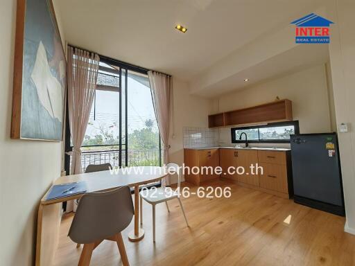 Modern kitchen with dining area and large window