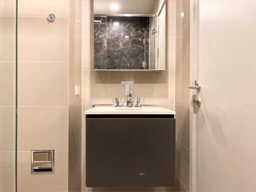 Modern bathroom with sleek vanity and marble details