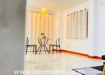 Bright and modern dining room with tiled flooring and elegant table setup