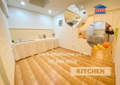 Modern kitchen interior with wooden flooring and well-lit ambiance