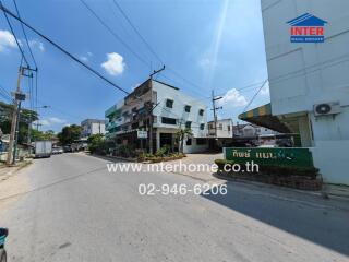 Street view of a commercial real estate property under a clear blue sky