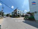 Street view of a commercial real estate property under a clear blue sky