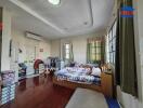 Spacious and furnished bedroom with ample natural light