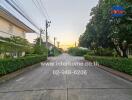 Quiet residential street at sunset with views of residential homes