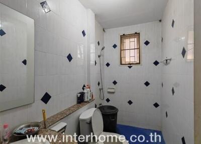 Bright and clean bathroom with modern tiling