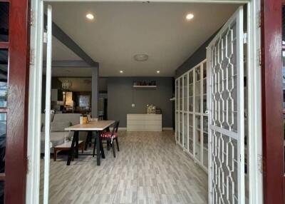 Elegant entrance hallway with arched doorway and modern interior