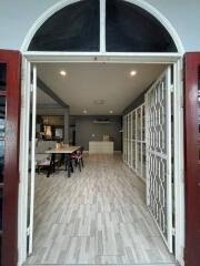 Elegant entrance hallway with arched doorway and modern interior