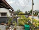 Well-maintained outdoor space with potted plants and paved flooring
