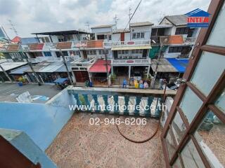 View from the balcony overlooking a lively neighborhood