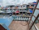 View from the balcony overlooking a lively neighborhood