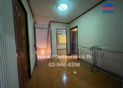 Spacious hallway in a residential property with decorative lighting