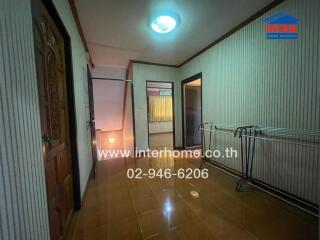 Spacious hallway in a residential property with decorative lighting