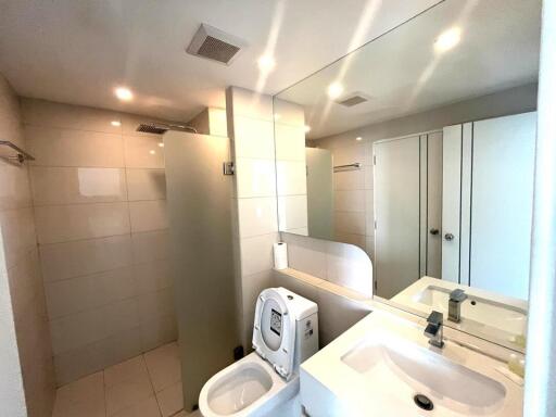 Spacious modern bathroom with bright lighting