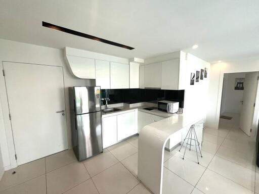 Modern kitchen with stainless steel appliances and white cabinets