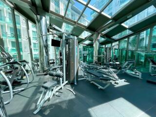 Modern gym with various equipment in a residential building