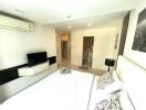 Modern bedroom with en suite bathroom and city view