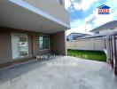 Spacious outdoor area of a modern home with concrete flooring and ample natural lighting