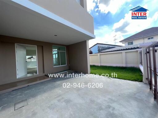 Spacious outdoor area of a modern home with concrete flooring and ample natural lighting