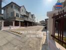 Residential street view with modern twin houses on a sunny day