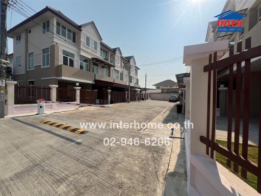 Residential street view with modern twin houses on a sunny day