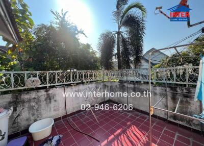 Spacious balcony with view of palm trees and ample sunlight