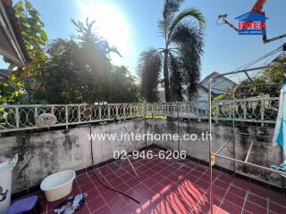 Spacious balcony with view of palm trees and ample sunlight