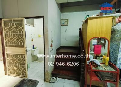 Interior view of a cluttered entryway in a residential building