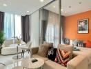 Modern living room with vibrant orange wall and stylish decor