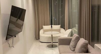 Modern living room with white sofas and sleek decor
