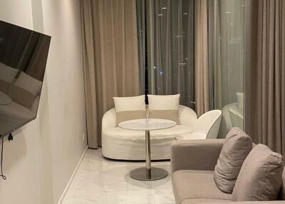 Modern living room with white sofas and sleek decor