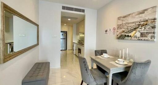 Modern dining area with adjacent kitchen in a contemporary apartment