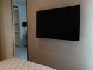 modern bedroom with mounted television