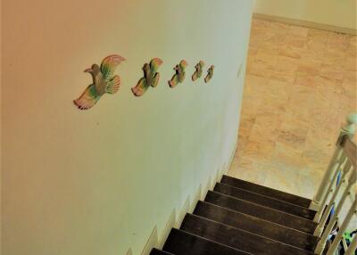 Elegant staircase in a residential property with contemporary wall decorations