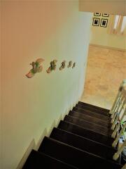 Elegant staircase in a residential property with contemporary wall decorations