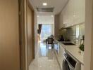 Modern kitchen with stainless steel appliances and view into the dining area