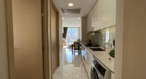 Modern kitchen with stainless steel appliances and view into the dining area