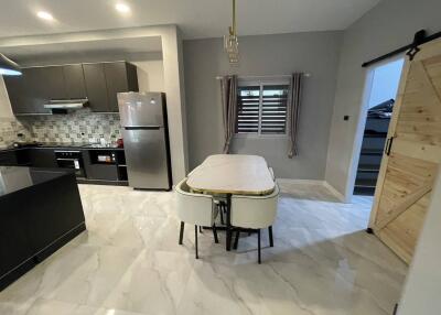 Modern kitchen with marble flooring and stylish furnishings