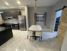 Modern kitchen with marble flooring and stylish furnishings