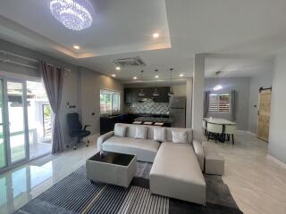 Spacious living room with integrated modern kitchen