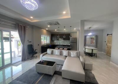 Spacious living room with integrated modern kitchen