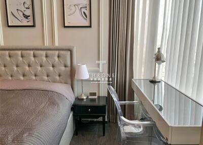 Elegant bedroom interior with modern furnishings and artworks